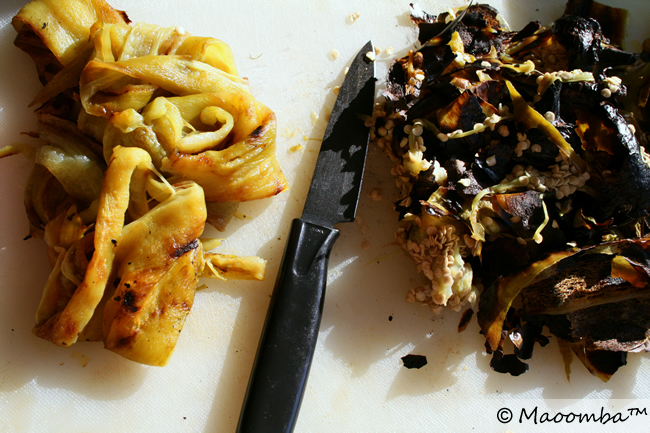 Peeled and cleaned chiles on one side; skins, seeds, and stems on the other.