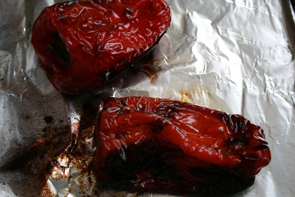 Roast peppers in oven for around 60 minutes, or until skin is evenly-blistered: wrinkles and charring are good signs. Rotate peppers as they cook.