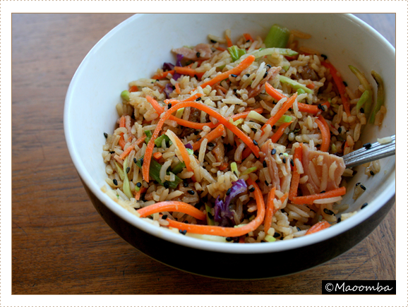 Ham fried rice with broccoli slaw and carrots, soy sauce, and sesame seeds
